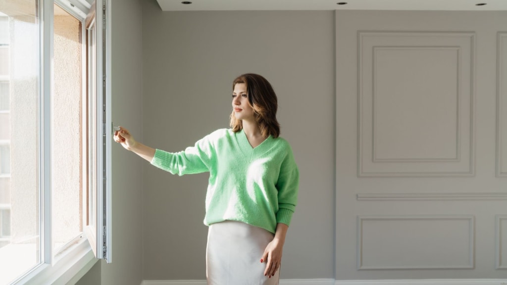 Woman Inspecting a New Home